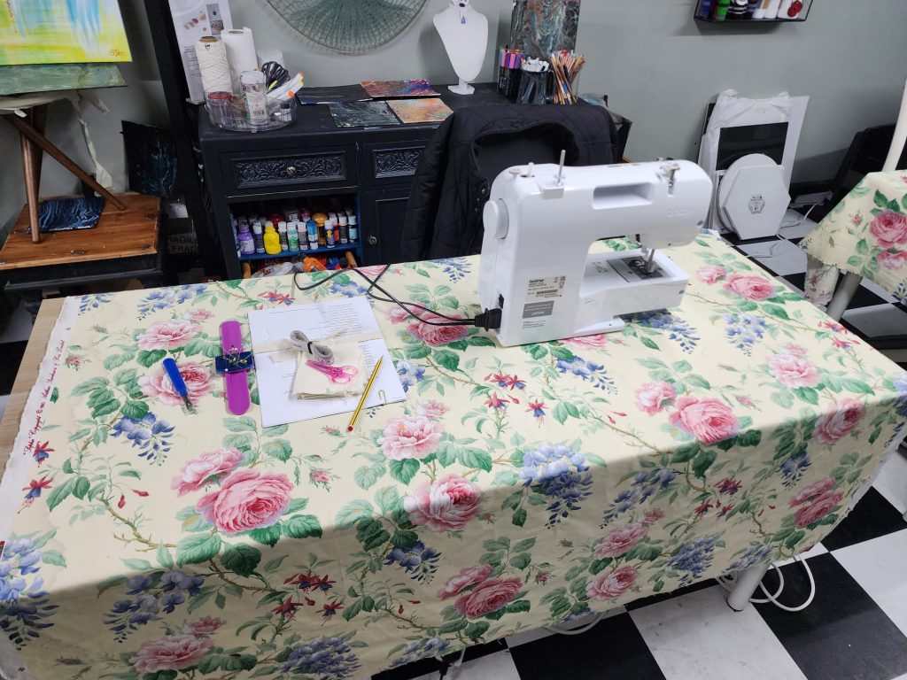 Sewing station setup with tools and materials before the workshop starts.
